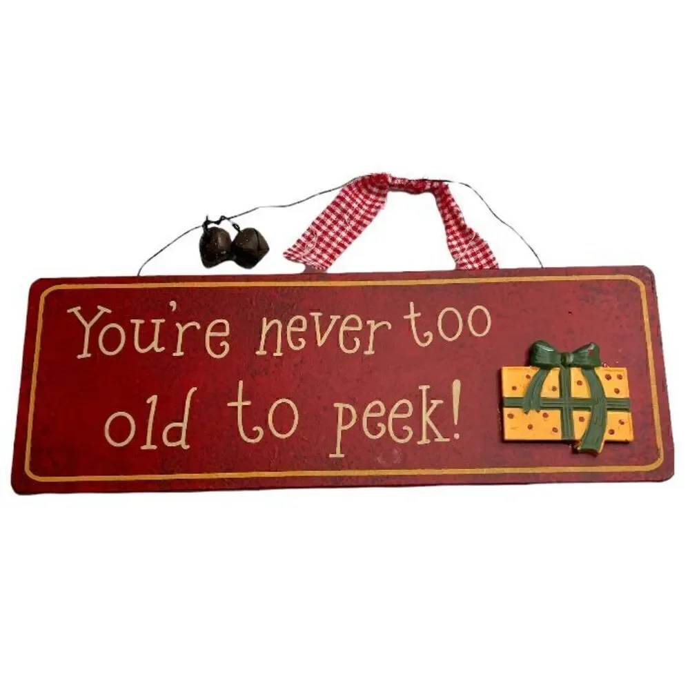 “You’re never too old to peek!” Sign